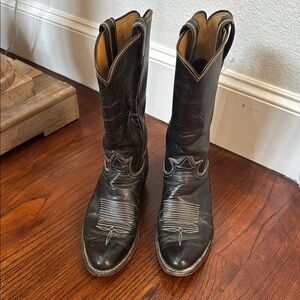 Tony Lama Tan black cowboy boots.